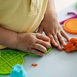 high-angle-kid-s-hands-with-playdough
